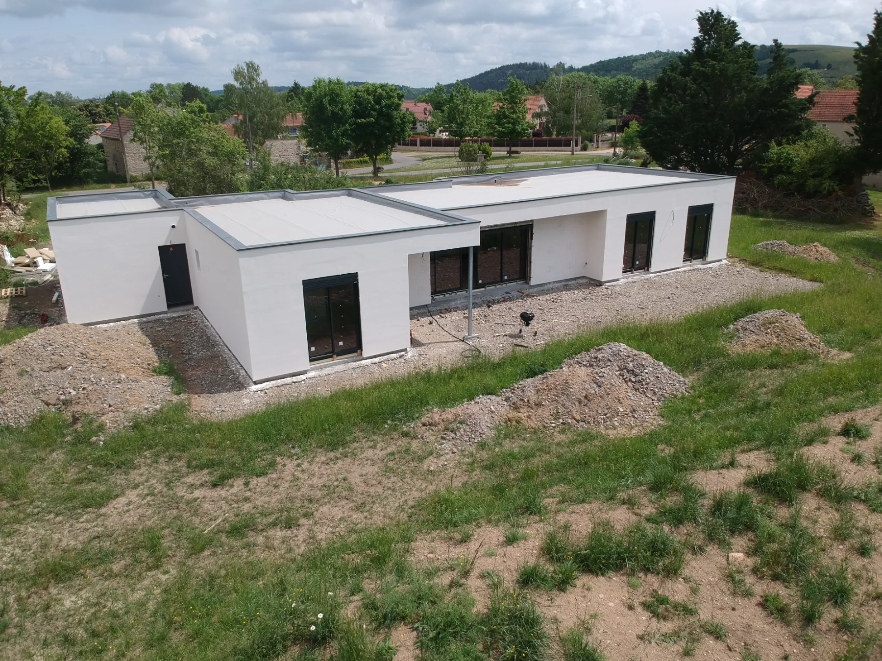 Maison individuelle de plain-pied à toiture terrasse en ossature métallique légère